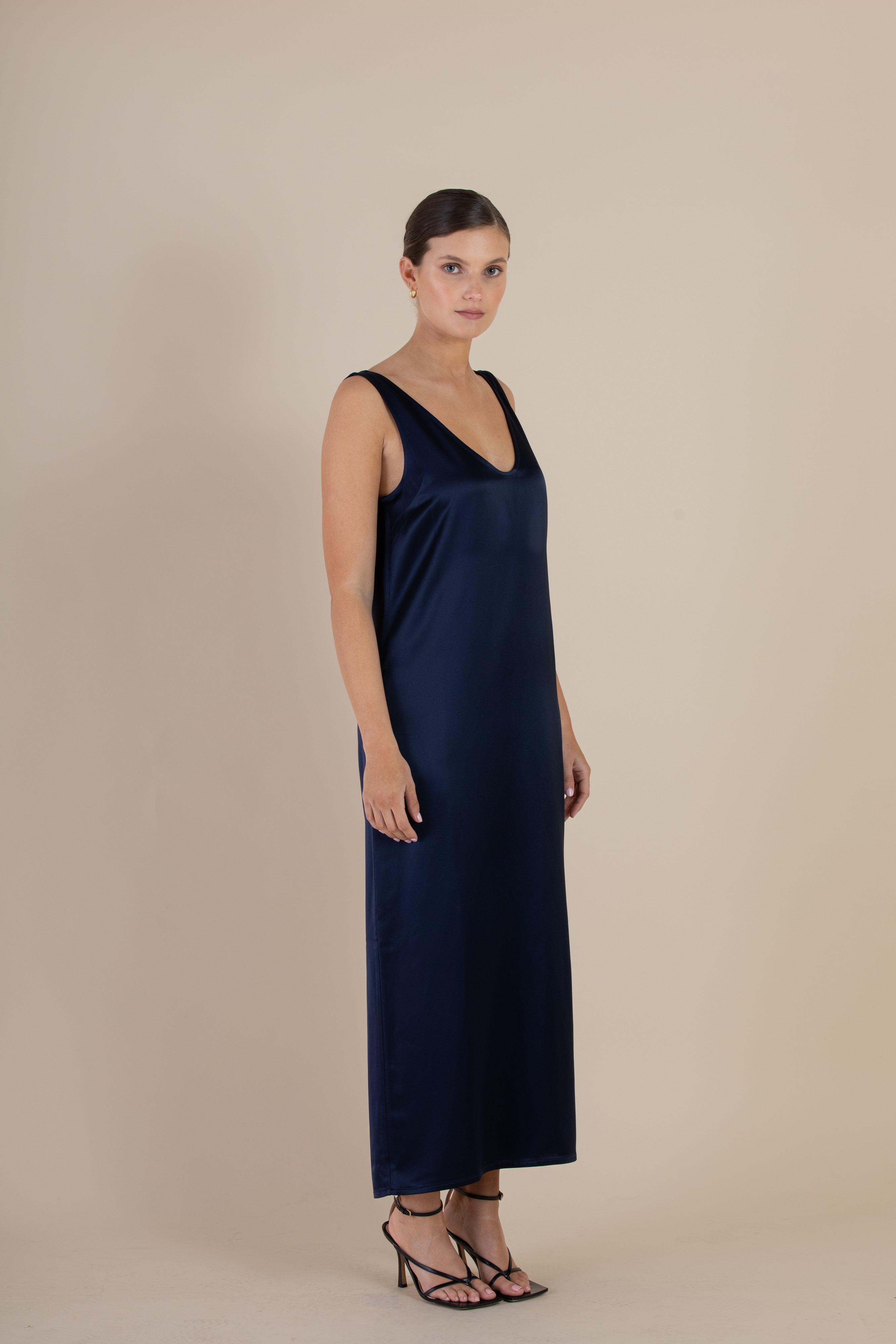 Side view of the SELFE Cora Slip Dress in Midnight – elegant slip dress that skims the body with fluid drape