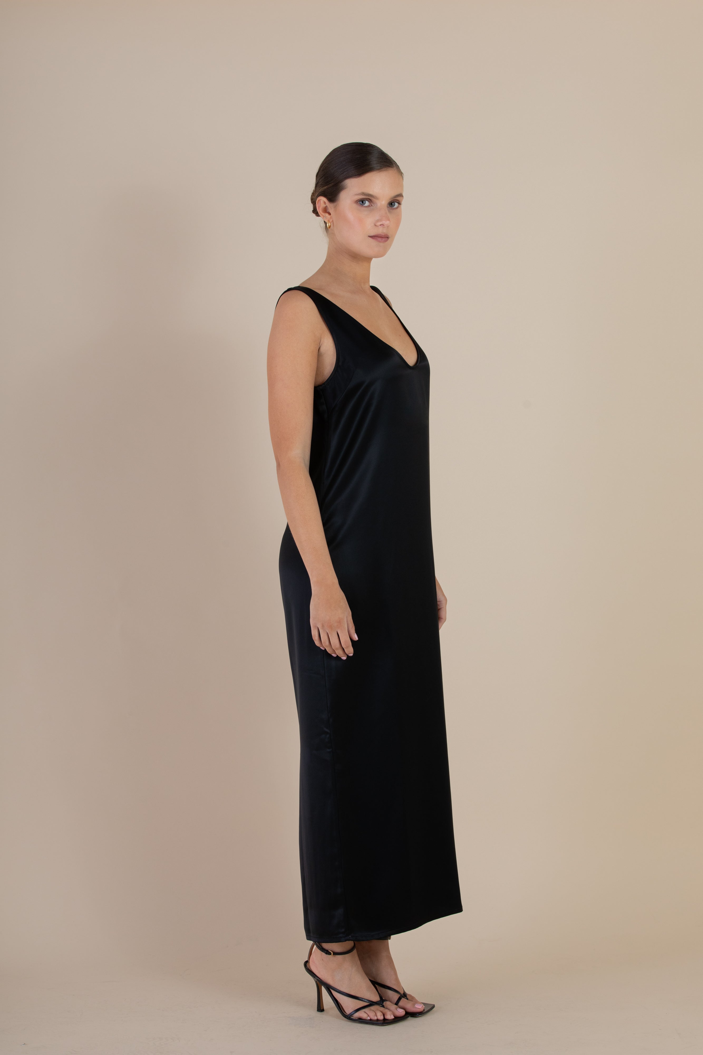 Side view of the SELFE Cora Slip Dress – elegant slip dress that skims the body with fluid drape
