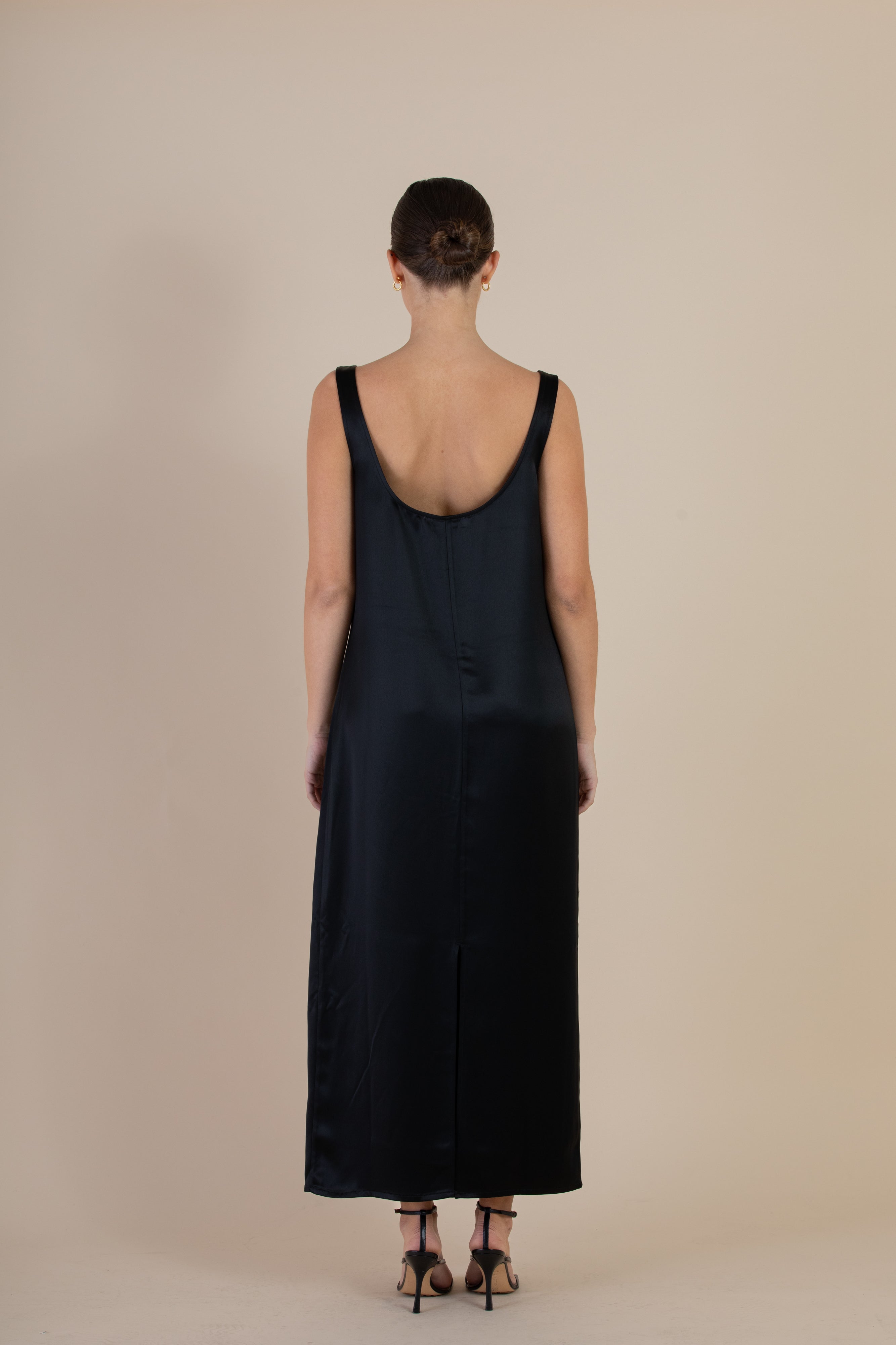 Back view of the SELFE Cora Slip Dress – ankle-length slip dress with refined silhouette and centre-back hem split