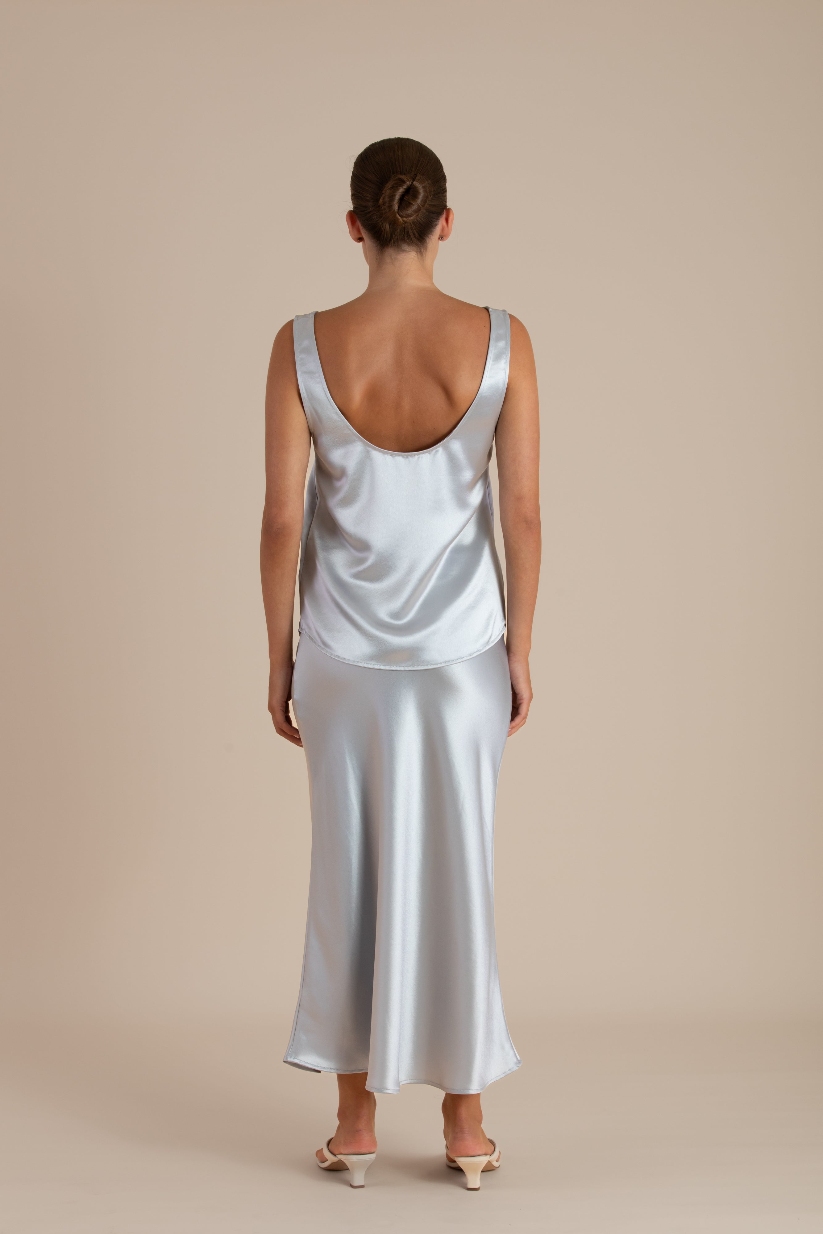 Margot Cami in Mystique satin styled with the Audrey Skirt, back view, showcasing the clean satin finish.